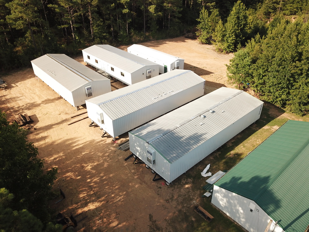 Areal photo of 5 temporary classroom trailers.